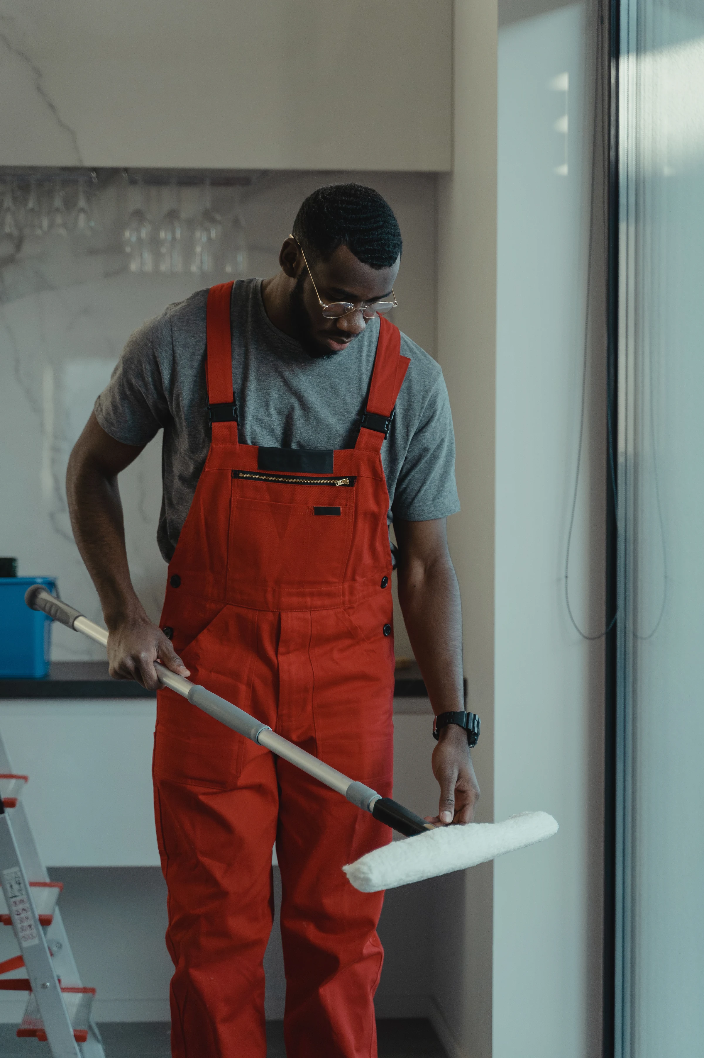 Floors: a cleaner in overalls at work